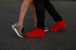 Fashion sneakers close-up. Couple Hug and kiss